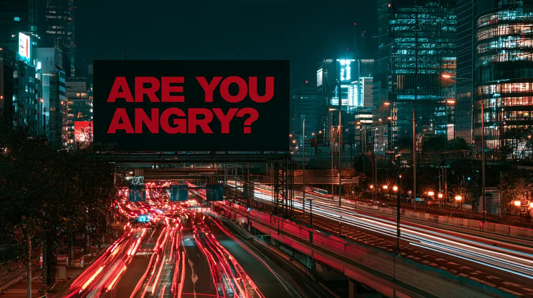 夜の東京の高速道路沿いの看板に「ARE YOU ANGRY?」